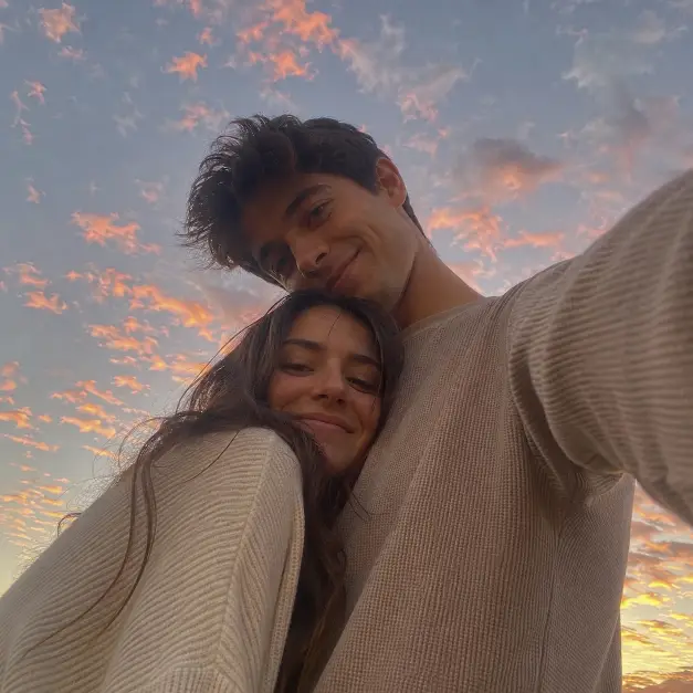 Low Angle Couple Selfie Prompt for Warm Sunset Photos